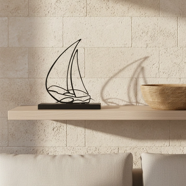 00025 asphalt black_decor A sleek metal sculpture capturing the essence of a sailing boat with minimalist lines and a modern aesthetic. Crafted with precision, this piece embodies elegance and sophistication, making it a captivating addition to various interior styles.