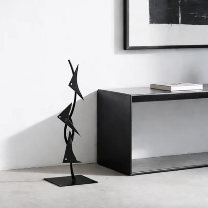 Enhance your space with the Fish Triangles, a contemporary sculptural piece that seamlessly blends minimalist design with artistic flair. Crafted from high-quality metal, this sculpture features a series of stylized fish forms arranged in a dynamic composition, embodying the fluidity and grace of marine life.