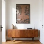 Roots of Love a captivating minimalist metal wall art piece featuring two stylized faces intertwined with flowing lines resembling tree roots and branches, symbolizing deep connection and growth. Crafted with precision and a subtle weathered finish, it adds emotional depth and natural elegance to modern interiors.