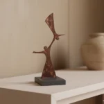 Human Relations an abstract metal sculpture designed by architect Dimitris Zelios, featuring interconnected human figures that exude elegance and modernity. Crafted with clean lines and fluid contours, this piece adds a touch of contemporary artistry to any setting. Ideal for living rooms, bedrooms, offices, and entryways seeking a subtle yet impactful decorative element.