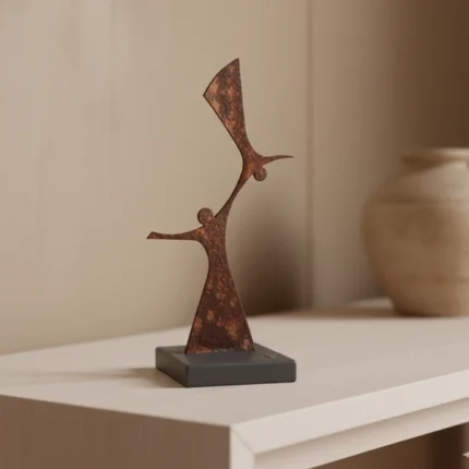 Human Relations an abstract metal sculpture designed by architect Dimitris Zelios, featuring interconnected human figures that exude elegance and modernity. Crafted with clean lines and fluid contours, this piece adds a touch of contemporary artistry to any setting. Ideal for living rooms, bedrooms, offices, and entryways seeking a subtle yet impactful decorative element.