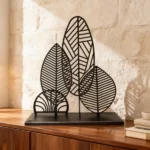 Metallic Leafs ,add a touch of nature-inspired elegance to your space with the Metallic Leafs sculptural décor piece by architect Dimitris Zelios. This minimalist design features a series of intricately cut metal leaves, creating a harmonious blend of organic form and contemporary artistry. The piece's clean lines and fluid contours evoke a sense of natural beauty, making it a unique focal point in any room.