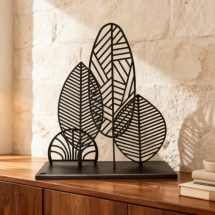 Metallic Leafs ,add a touch of nature-inspired elegance to your space with the Metallic Leafs sculptural décor piece by architect Dimitris Zelios. This minimalist design features a series of intricately cut metal leaves, creating a harmonious blend of organic form and contemporary artistry. The piece's clean lines and fluid contours evoke a sense of natural beauty, making it a unique focal point in any room.