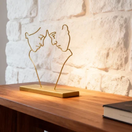 Couple Goals a sleek metal sculpture portraying two abstract human figures standing side by side, connected yet distinct. The minimalist design emphasizes unity and companionship through simple, elegant lines. Ideal for: Modern living rooms, bedrooms, offices, or spaces celebrating relationships and togetherness.