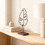 Leaf a sculptural metal leaf design by architect Dimitris Zelios, combining minimalist elegance with organic form. Τhis piece adds a touch of nature-inspired artistry to any modern interior.