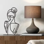 Ballerina's Back a minimalist metal sculpture capturing the elegant and poised back of a ballerina. Crafted with clean lines and smooth contours, this piece highlights grace and subtle beauty, offering a refined artistic touch to any space. Ideal for: Modern living rooms, bedrooms, offices, or children’s rooms looking for a delicate and stylish accent.