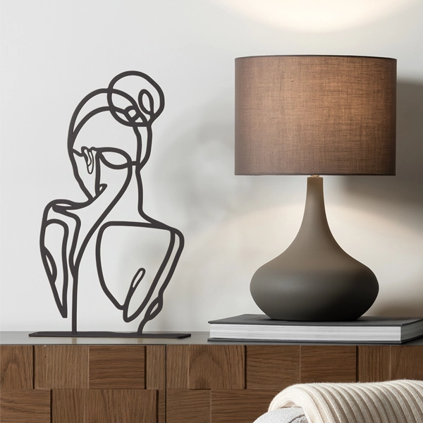 Ballerina's Back a minimalist metal sculpture capturing the elegant and poised back of a ballerina. Crafted with clean lines and smooth contours, this piece highlights grace and subtle beauty, offering a refined artistic touch to any space. Ideal for: Modern living rooms, bedrooms, offices, or children’s rooms looking for a delicate and stylish accent.