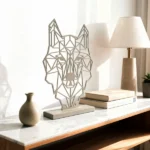A minimalist metal sculpture capturing the essence of a wolf through sleek lines and a modern aesthetic. Crafted with precision, this piece embodies strength and elegance, making it a captivating addition to various interior styles. Ideal for: Contemporary living rooms, offices, or children's rooms seeking a unique and artistic accent.