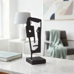 Abstract Face a minimalist metal sculpture designed by architect Dimitris Zelios, featuring a stylized facial profile that exudes elegance and modernity. Crafted with clean lines and fluid contours, this piece adds a touch of contemporary artistry to any setting. Ideal for Living rooms, bedrooms, offices, and entryways seeking a subtle yet impactful decorative element.