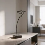 "Bird", is an elegant metal sculpture with a stylized design, emphasizing fluid curves and balance. The piece combines simplicity with artistic expression. Ideal for: Living rooms, offices, or any space that benefits from a touch of natural elegance.