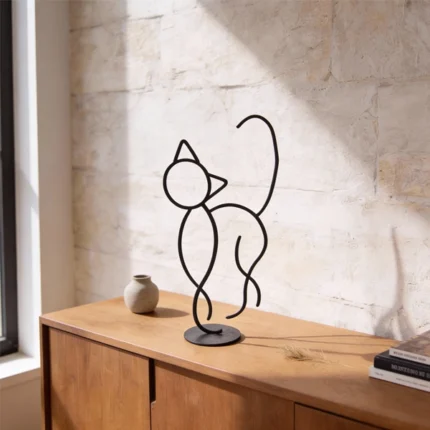 A minimalist metal sculpture capturing the sleek form and curious posture of a cat. Its simple lines create a calm yet playful presence with a durable design ideal for both indoor and outdoor settings. Ideal for: Shelves, desks, cozy corners, gardens, or outdoor spaces in homes or offices with a love for feline grace.