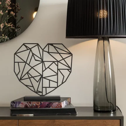 Heart Geometry a modern interpretation of the universal symbol of love, Heart Geometry blends clean lines and sharp angles into an abstract yet instantly recognizable form. Crafted in metal, this piece exudes emotional depth while maintaining a minimalist aesthetic. Ideal for living rooms, bedrooms, or entryways where a subtle yet meaningful expression of love and connection is desired.
