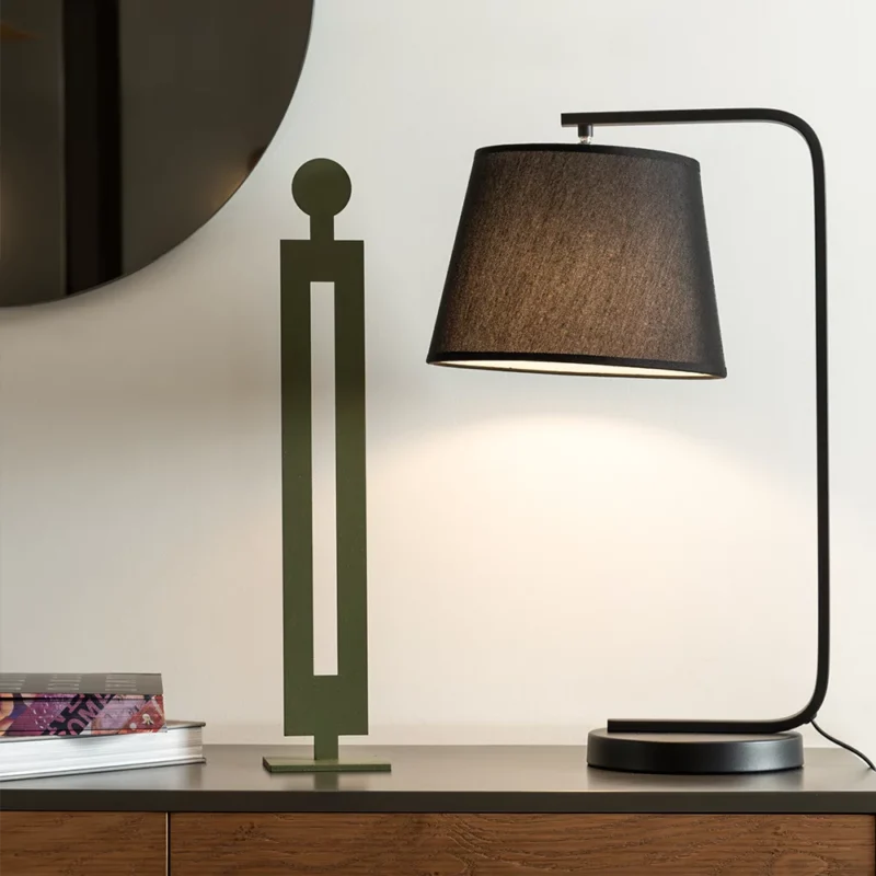 Standing Tall a minimalist metal sculpture depicting an abstract human figure in an upright stance. Crafted with clean lines and a contemporary design, this piece embodies strength and elegance, making it a captivating addition to various interior styles. Ideal for: Modern living rooms, offices, or spaces seeking a unique and artistic accent.