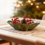 Snowflakes Christmas bowl by DIZE Art Objects. A sculptural metal bowl featuring delicate lasercut snowflake motifs, designed to bring subtle festive charm to your space. The “Christmas Bowl – Snowflakes” blends minimal elegance with holiday warmth, making it an ideal decorative accent for tables, consoles, or centerpieces. A refined seasonal touch by DIZE Art Objects.