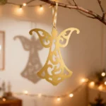 Angel | DIZE Art Objects. A delicate metal hanging ornament featuring an elegant angel silhouette with intricate cut-out details. The Angel adds a graceful decorative touch to any space — from festive displays to everyday interiors. A refined, lightweight accent crafted in the signature style of DIZE Art Objects.