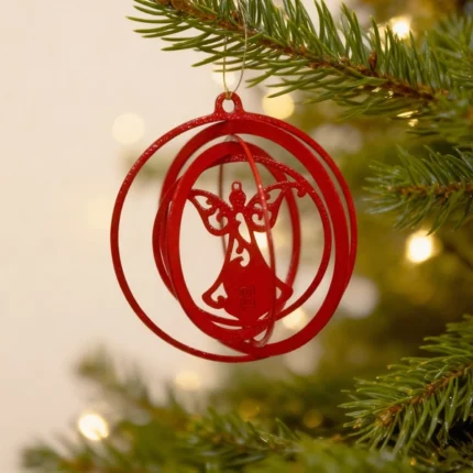Halo Angel Ornament. A modern metal Christmas ornament by DIZE Art Objects, featuring an elegant angel silhouette framed by floating rings. Minimal and refined, it adds a gentle festive touch to any tree or holiday corner.