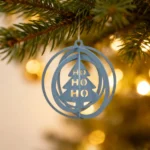 Halo Tree Ornament. A contemporary metal ornament by DIZE Art Objects, showcasing a stylized Christmas tree within delicate concentric rings. Perfect for adding a clean, modern highlight to your seasonal décor.